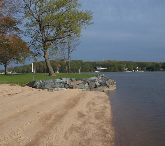 border wall at edge of lake and park